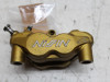 Brake caliper left front Triumph Tiger 1050