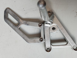 Footrest left Aprilia RSV 1000