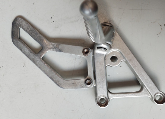 Footrest left Aprilia RSV 1000