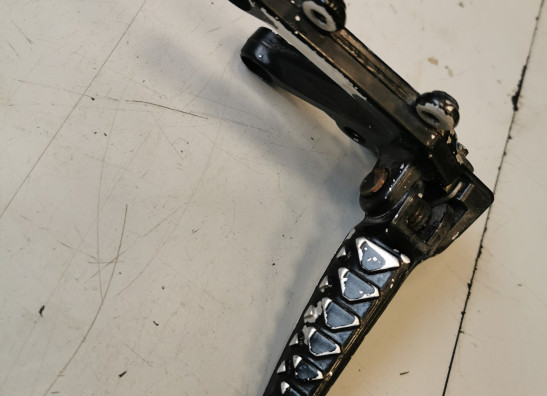 Footrest left Aprilia RSV 1000