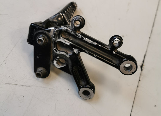 Footrest left Aprilia RSV 1000