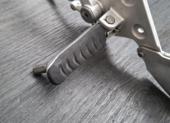 Main step holder left Triumph Tiger 1050