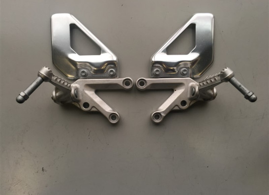 Footrest left Aprilia RSV 1000