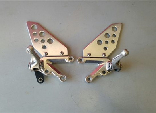Footrest left Aprilia Tuono 1000